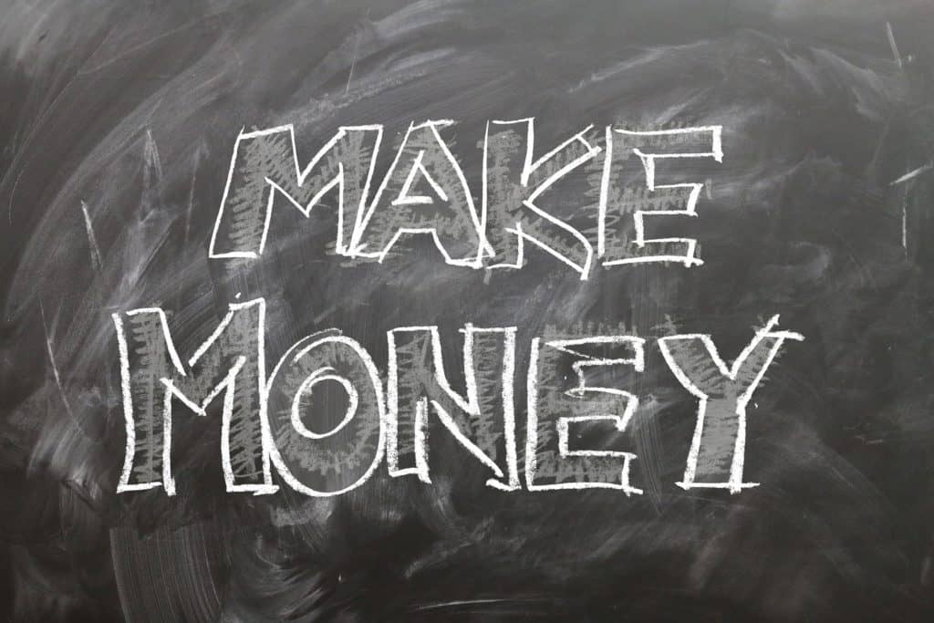 chalkboard with the words make money written on it 